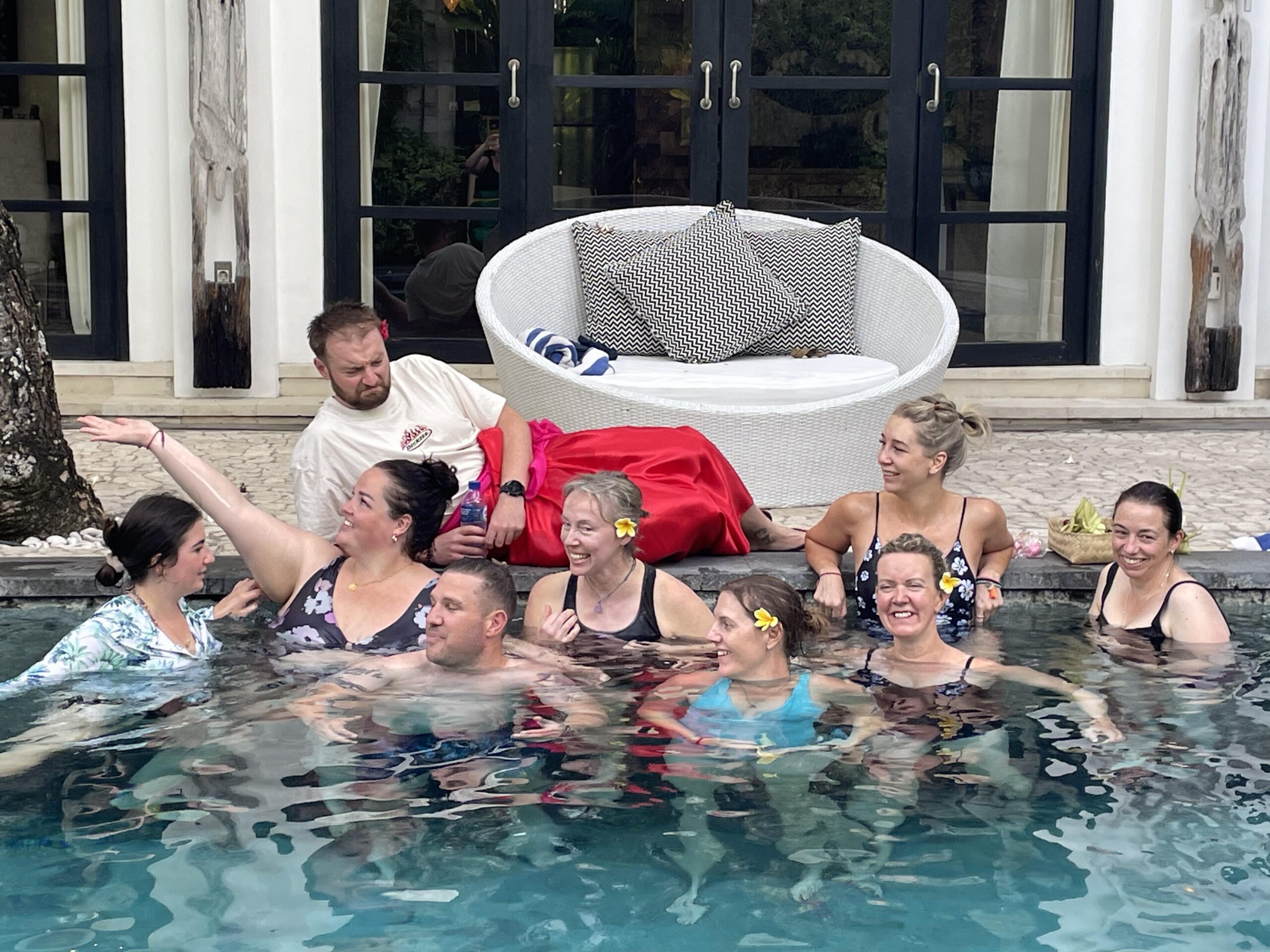 Group photo of Jemimah Ashleigh 2024 Bali retreat - sitting in the pool.